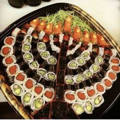 sushi platter with various types of sushi on it