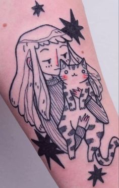 a tattoo with a cat and stars on it's arm that says, i love you