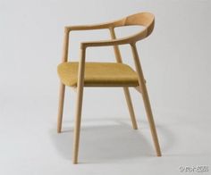 a wooden chair with yellow upholstered seat and armrests, on a white background