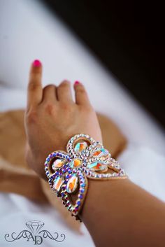 a woman's hand with a bracelet on it