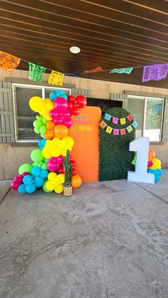 an entrance decorated with balloons and streamers