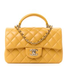 This is an authentic CHANEL Lambskin Quilted Mini Top Handle Rectangular Flap in Yellow. This chic petite shoulder bag is crafted of diamond quilted lambskin leather in yellow. The crossbody bag features a top handle, a long gold chain-link leather threaded shoulder strap and a frontal flap with a Chanel CC turn lock. The flap opens to an interior of smooth leather with zipper and patchpockets. Top Handle Flap Bag With Cc Turnlock For Shopping, Shopping Flap Bag With Cc Turnlock And Top Handle, Flap Bag With Cc Turnlock Closure For Shopping, Classic Yellow Evening Bag, Elegant Yellow Satchel Flap Bag, Rectangular Shopping Bags With Cc Turnlock Closure, Classic Yellow Shoulder Bag For Formal Occasions, Elegant Yellow Leather Flap Bag, Elegant Yellow Rectangular Flap Bag