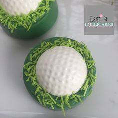 two cupcakes decorated with green and white icing