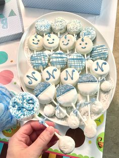 a plate with blue and white marshmallows on it