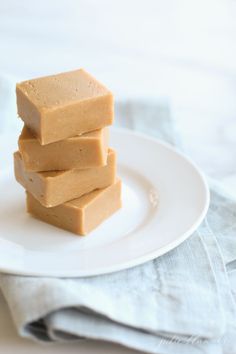 three pieces of peanut butter fudge on a white plate