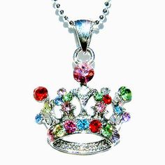 "PERFECT CHRISTMAS GIFT FOR LADIES You are getting a Princess / Queen Crown Pendant with Swarovski crystals. It comes with a FREE 16\" Original Rhodium Plated Snake Chain necklace with lobster clasp. Crown size is 1\" (2.5cm) wide X 7/8\" (2.2cm) high. Crystal Color: AQUA, JONQUIL, PERIDOT, CRYSTAL CLEAR, LIGHT AMETHYST, ROSE, LIGHT ROSE, SIAM RED Prices are in US$. For shipping policies and other important information, click on \"profile\" on the right. See an item that you like but has already Multicolor Jeweled Rhinestone Necklace For Gift, Multicolor Jeweled Rhinestone Necklace Gift, Silver Rhinestone Jewelry For Birthday, Multicolor Rhinestone Crystal Necklace As Gift, Multicolor Rhinestone Wedding Necklaces, Multicolor Rhinestone Necklaces For Weddings, Multicolor Rhinestones Necklace For Wedding, Silver Crystal Jewelry With Crown Design, Jeweled Crystal Rhinestone Necklace As Gift