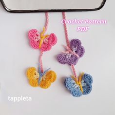 three crochet butterflies hanging from a string on a white surface with text overlay that says crochet pattern pdf