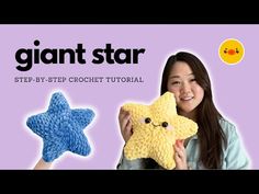 a woman holding up a crochet star with the words giant star on it