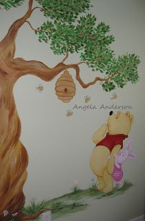 a winnie the pooh wall mural in a child's room with a tree and beehive