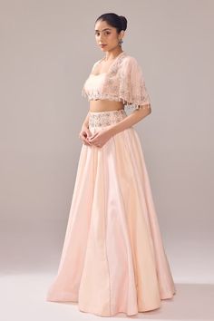 Blush cape with pearl, cutdana, crystal, bead embroidery in floral pattern. Paired with tube blouse and waistband embroidered lehenga. - Aza Fashions Tube Blouse, Cape Lehenga, Lehenga And Blouse, Dimensional Embroidery, Embroidered Cape, Pink Lehenga, Embroidered Lehenga, Western Wedding, Fashion App