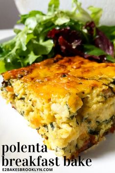 a piece of quiche on a white plate with lettuce and salad in the background