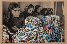 an old photo of women sitting on the floor in front of some blankets and rugs