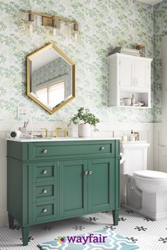 a bathroom with green vanity and white toilet