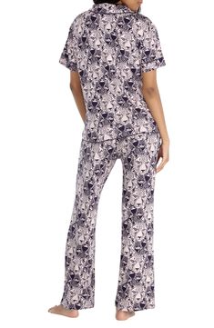 Bring a little extra luxury to your nighttime routine with these cozy PJs featuring a button-up top with short sleeves and matching pants. Notched collar Short sleeves 95% rayon, 5% spandex Machine wash, dry flat Imported