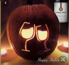 a pumpkin with two wine glasses carved into it's face and the words happy halloween