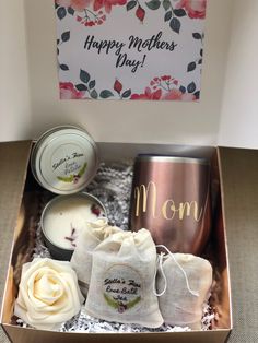 a mothers day gift set in a box with candles, tea bags and soaps