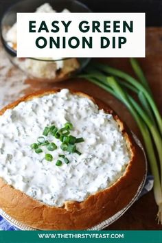 an easy green onion dip in a bread bowl