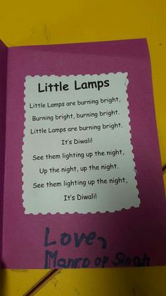 a pink book with writing on it that says, little lamps lite lamps are burning bright