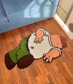 a rug with a cartoon character laying on the floor