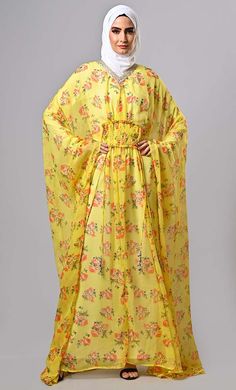 Modest yellow floral printed kaftan abaya with lining and tassels - EastEssence.com Floor-length Floral Print Kaftan For Spring, Spring Floral Print Floor-length Kaftan, Printed Kaftan For Eid, Elegant Floral Print Kaftan For Eid, Eid Floral Print Long Sleeve Abaya, Floral Print Kaftan For Eid Vacation, Spring Vacation Floor-length Abaya, Traditional Yellow Kaftan With Floral Print, Floral Print Maxi Kaftan For Eid