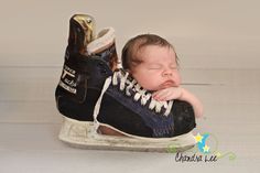 a baby sleeping in a pair of shoes