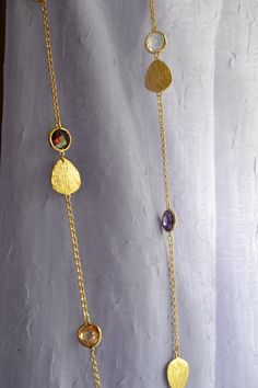 Florentine Finish and Color Faceted Beads 34" Gold Necklace Luxury Gold Crystal Necklaces With Faceted Beads, Cheap Multi-strand Gold-tone Necklace, Luxury Necklaces With Faceted Beads, Luxury Artisan Faceted Necklaces, Luxury Gold-tone Necklace With Polished Finish, Gold Long Necklace With Natural Stones For Gift, Gold Oval Necklace With Faceted Beads, Gold Oval Necklaces With Faceted Beads, Oval Gold Necklaces With Faceted Beads