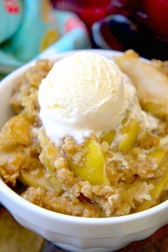 a close up of a bowl of food with ice cream on top