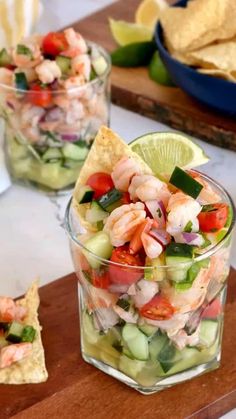 shrimp and cucumber salad in a glass with tortilla chips on the side