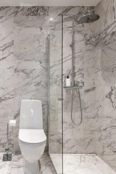 A marble tile bathroom with chrome fixtures for a luxurious effect