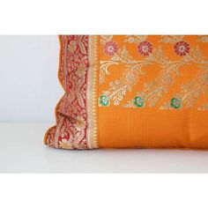 Custom made lumbar silk pillow made from a wedding silk sari in orange, fushia, gold and green colors.  Decorative twisted trims all around.  Luxury Rajasthan Mughal style decorative lumbar pillow.  Made in India.   Details  Dimensions  Height: 13 in. (33.02 cm)  Width: 26 in. (66.04 cm)  Depth: 4 in. (10.16 cm)  Style  Anglo Raj (In the Style Of)  Materials and Techniques  Hand-Crafted  Silk  Place of Origin  India  Period  1990-1999  Date of Manufacture  1999  Condition  Good  Wear consistent Orange Dupatta With Border For Wedding, Sari India, Wedding Orange, Decorative Lumbar Pillows, Gold And Green, Silk Sari, Silk Pillow, Best Wear, Lumbar Pillow