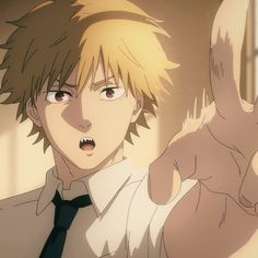 an anime character with blonde hair pointing at something in front of him and holding his hand up