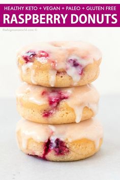 three raspberry donuts stacked on top of each other