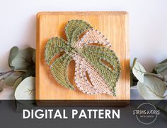 an image of a wooden cutting board with leaves on it and the words digital pattern