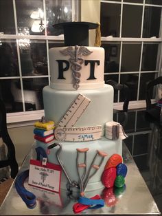 a graduation cake decorated with medical supplies