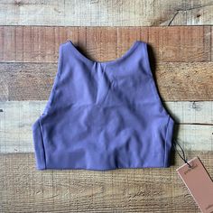 Girlfriend Collective Topanga Sports Bra In A Size Extra Small. Grayish Purple In Color. Halter Bra Style With Adjustable Straps. Can Also Wear Like A Crop Top. Low Impact Bra. Made From Recycled Water Bottles. Features: High-Neck A Low Back Adjustable Criss-Cross Straps Four-Way Stretch Condition: New With Tags Fitted Yoga Top With Built-in Padding, Fitted T-back Crop Top For Yoga, Racerback Crop Top With Built-in Padding For Yoga, Fitted Tank Sports Bra With Built-in Padding, Summer Sports Bra With Built-in Padding, High Stretch T-back Tops For Sports, Fitted T-back Activewear For Yoga, Solid Seamless Crop Top For Training, Solid Training Crop Top With Seamless Construction