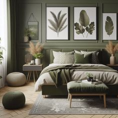 a bedroom with green walls and pictures on the wall above the bed, as well as a footstool