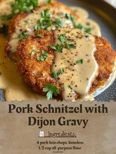 pork schnitzel with dijon gravy on a plate