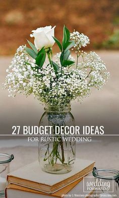 a vase filled with white flowers sitting on top of a table