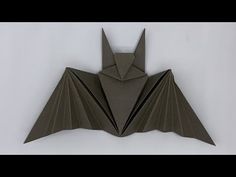 an origami bat hanging on the wall