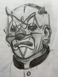 a pencil drawing of a clown's face with horns and nose rings on his head