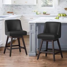 two black barstools in a white kitchen