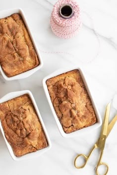 three small white dishes filled with baked goods