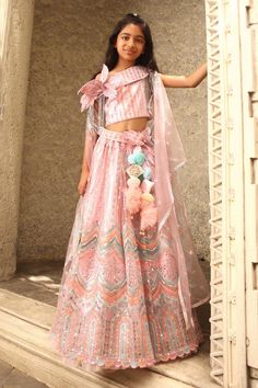 Pink crop top with sequin, cutdana, 3D flower embroidery and draped dupatta. Paired with skirt.
Components: 2
Pattern: Embroidery
Type Of Work: Sequin, cutdana, 3D flower
Neckline: Round
Sleeve Type: Sleeveless
Fabric: Net
Color: Pink
Other Details: 
Attached belt
Occasion: Festive and Wedding - Aza Fashions Party Wear Skirt Set With Traditional Drape For Reception, Festive Mirror Work Skirt Set For Party, Festive Party Wear Embellished Skirt Set, Embellished Skirt Set For Festive Party Wear, Festive Embellished Party Wear Skirt Set, Festive Party Skirt Set With Mirror Work, Festive Embellished Skirt Set For Party Wear, Party Saree Skirt Set With Sheer Dupatta, Festive Party Wear Skirt Set For Reception