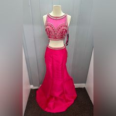 Hot Pink Two-Piece Mermaid Dress *Splash Prom *Size 4 *Never Worn, Brand New With Tags * This Is A 2 Piece Hot Pink Mermaid Dress Set. The Bottom Is Simple Long Hot Pink Skit With A Silver Jeweled Waist Belt Added For Simple Detail. The Top Is High Neck With Hot Pink Mesh Lining The Front And Back. The Top Is Also Jeweled To Show Off A Sweetheart Neckline. Pink Mermaid Dress, Pink Two Piece, Long Hots, Pink Mermaid, Dress Set, Mermaid Dress, Waist Belt, Sweetheart Neckline, Set Dress