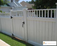 an image of a white fence in the yard