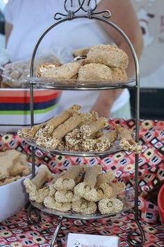 three tiered trays filled with pastries on a table