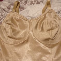 Longline Shapewear In Nude With Slimming Leg Nwot Very Light Padding In Cups. Underwire Stationary Straps Not Removable Light To Moderate Control 79% Nylon, 21% Spandex Lycra Shapewear Items Whether Nwt Or Nwot Have Only Been Tried On And Not Worn Unless Other Wise Stated. Be Aware That Due To The Nature Of The Nylon Fabric There Can Be Small Picks In The Item Simply From Handling And Being Stored Against Other Items. The Stretch On All Items Is Good And Tight For Long Durability Or I Would Not Fitted Full Coverage Bra With Lined Body, Fitted Underbust Shapewear Bra, Fitted Beige Camisole Bra, Elegant Fitted Gold Camisole, Fitted Bra With Medium Bust Support, Sleeveless, Fitted Full Cup Bra With Lined Body, Fitted Full Coverage Shapewear Bra, Fitted Beige Shapewear Bra, Beige Fitted Shapewear Bra