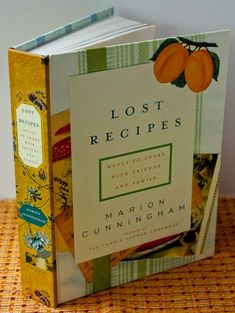 the book lost recipes is sitting on a table