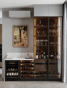 a wine cabinet with many bottles and glasses in it