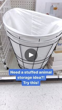 a large white basket sitting on top of a shelf